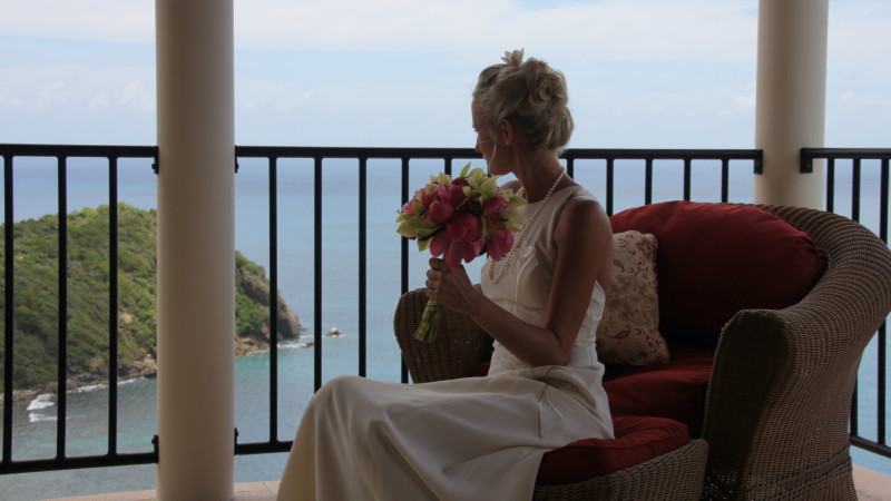Caribbean destination wedding - bride on Master Bedroom porch overlooking Rogue's Point