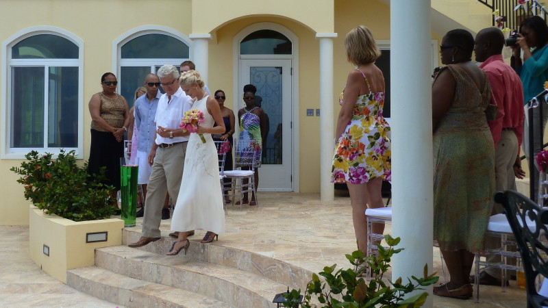 Father and daughter descending the two-tiered pool deck at AnaCapri Estate