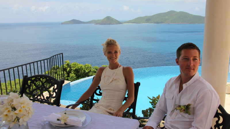 Wedding couple relaxing by the Infinity edge pool at AnaCapri Estate